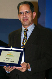 Dr. Alfred Mller presenting an award for the X-Car